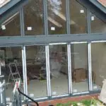 Outside Central View of Bifold Doors with Custom Window